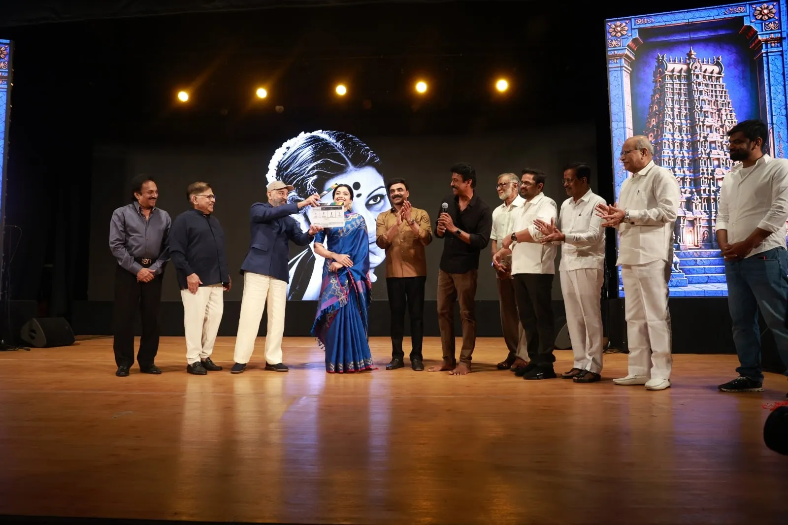 Kamal Haasan holds the clapperboard beside Rashmika Mandanna and the M.S. biopic team at the Chennai launch