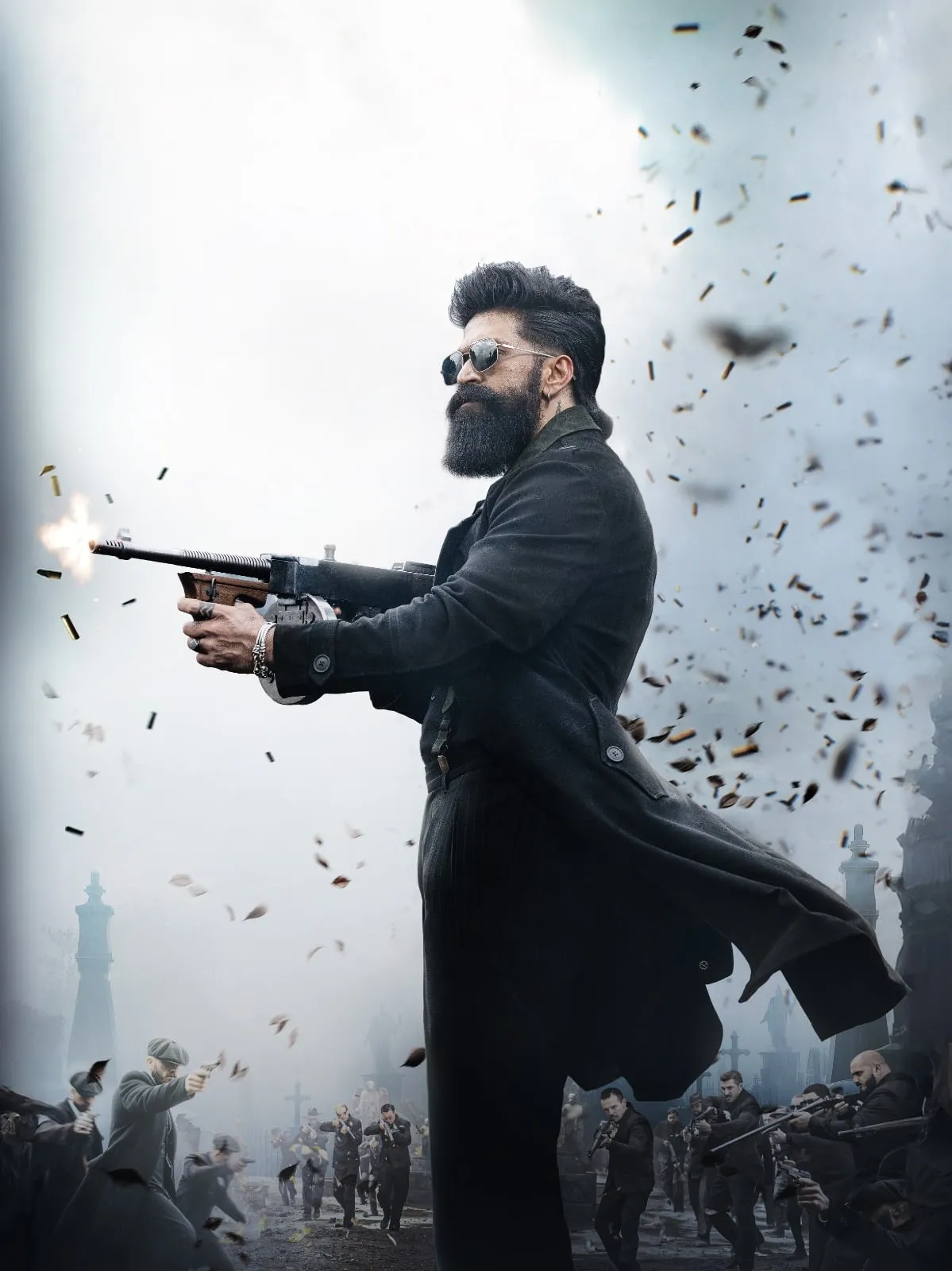 Yash firing a tommy gun in a long coat amid swirling debris, character poster from Toxic