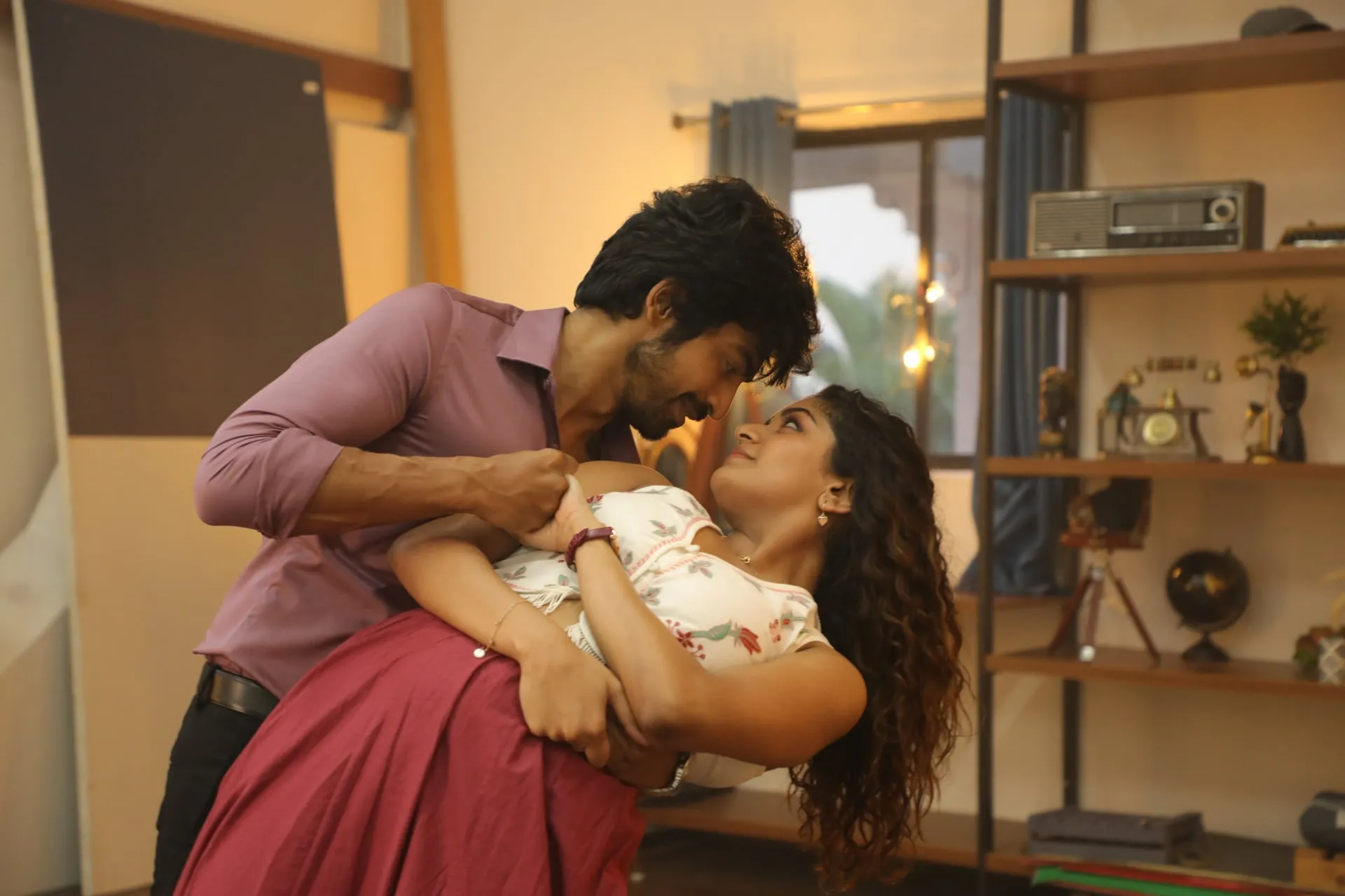Arjun Das dips Aditi Shankar mid-dance in a warmly lit room in Once More, the two locked in a smiling gaze