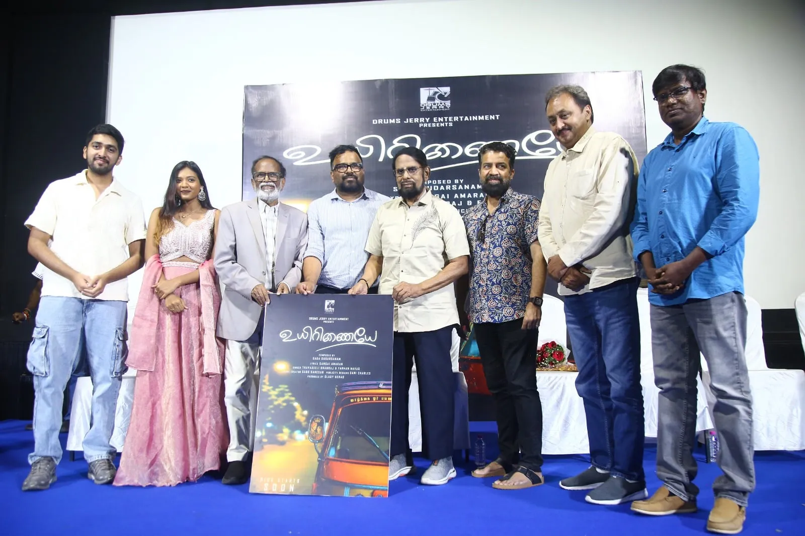 Gangai Amaran and the Uyirinaiyae team on stage with the single's poster at the Chennai launch