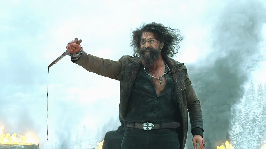 Yash as Raya in Toxic, bloodied knife in hand against a snowscape