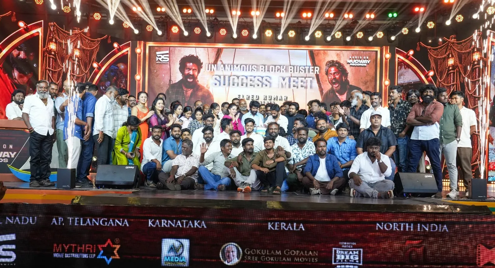 The Mandaadi cast and crew gather on stage for a group photograph at the success celebration