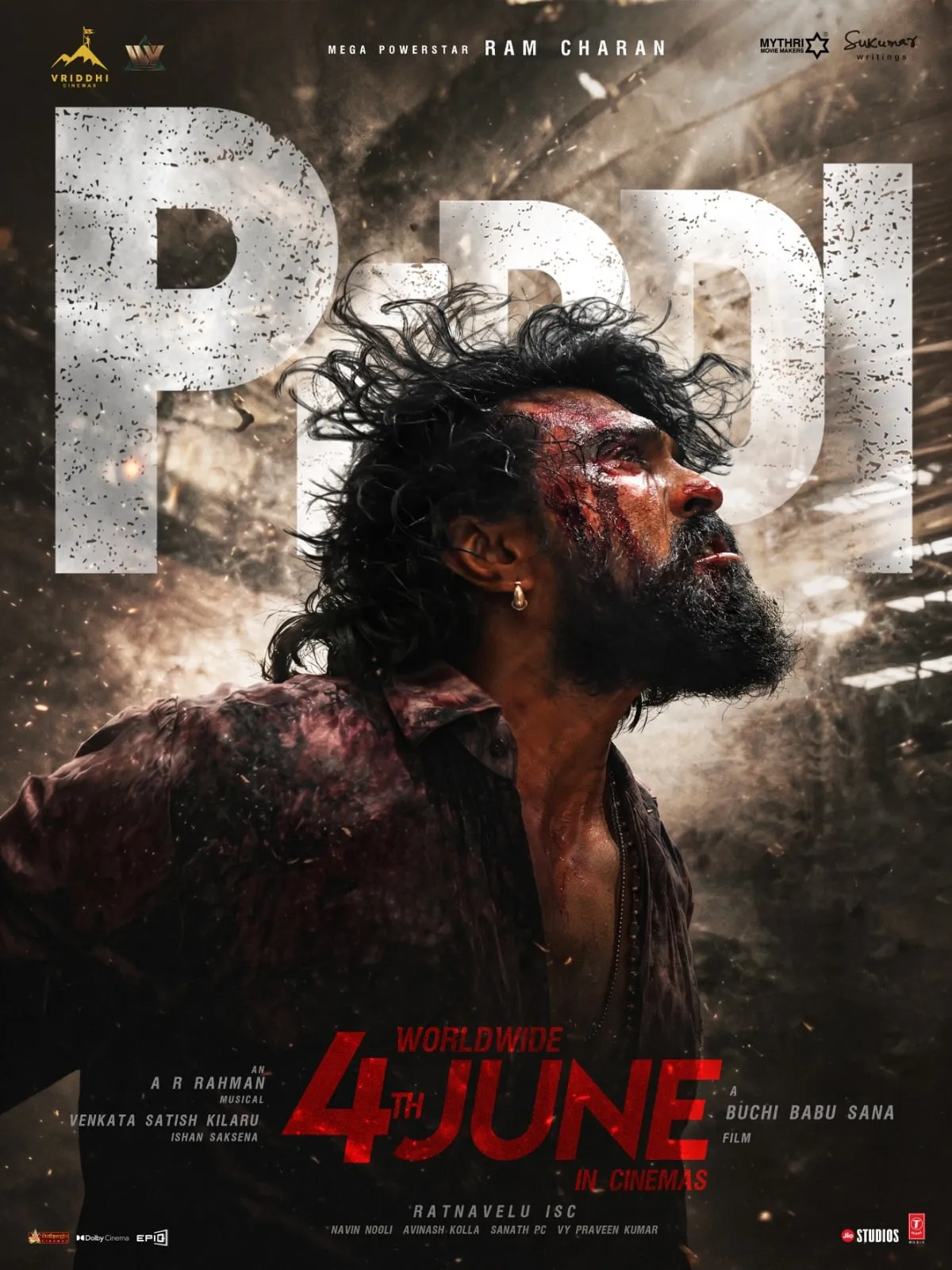 Peddi release-date poster with Ram Charan bloodied and roaring against a smoke-filled backdrop