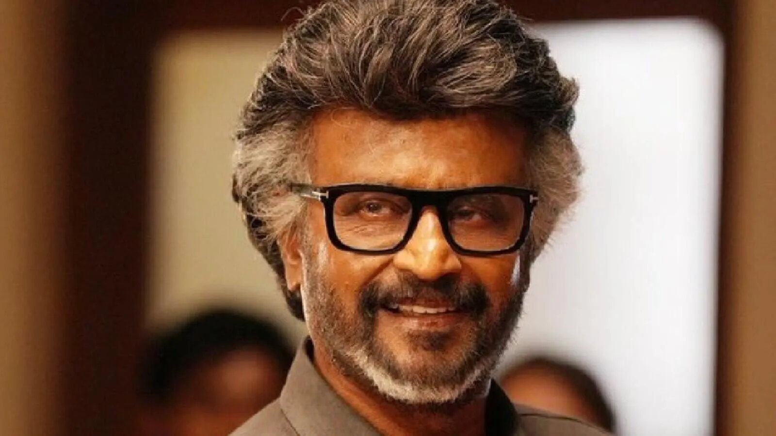 Rajinikanth smiling in thick black glasses in a still from Jailer 2