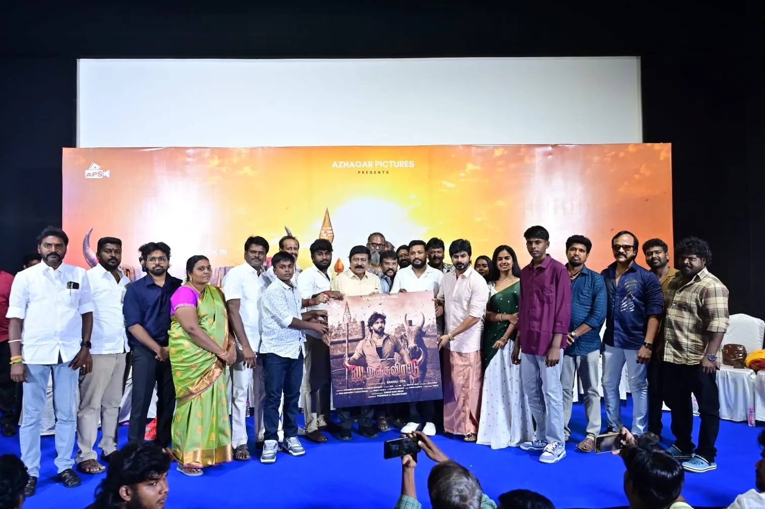 The cast and crew of Vada Manjuvirattu unveiling the film's poster on stage at its trailer and songs launch in Chennai