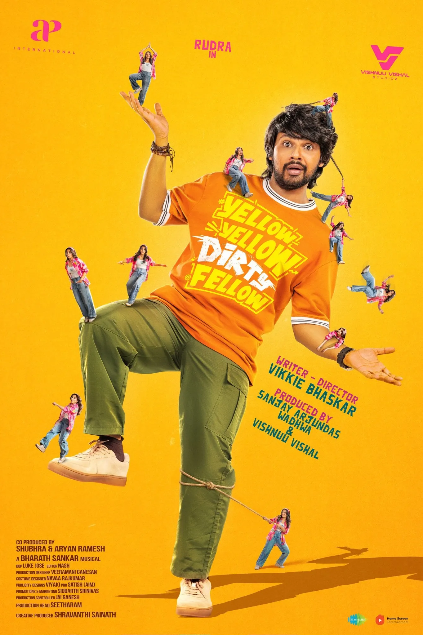 Yellow Yellow Dirty Fellow first look featuring Rudhra striking a contorted dance pose in an orange tee and olive trousers against a yellow backdrop, with smaller cut-outs of his co-star scattered around him and the film's title splashed across his chest