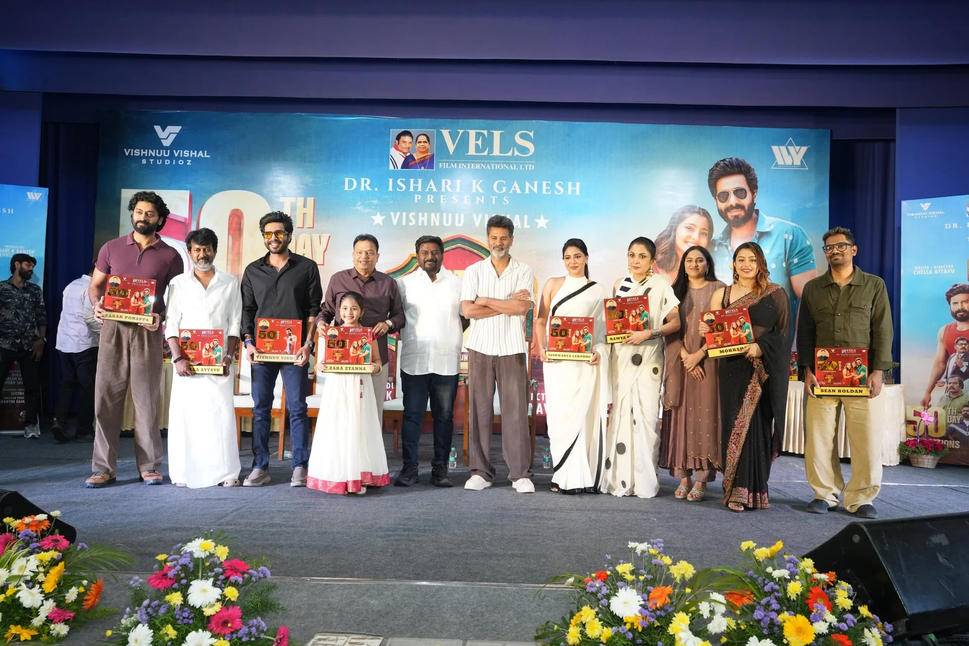 The Gatta Kusthi 2 cast and crew holding their 50th-day shields onstage, with Vishnuu Vishal, Zara, Prabhu Deva, Aishwarya Lekshmi, Ramya Krishnan and Mokksha in the line