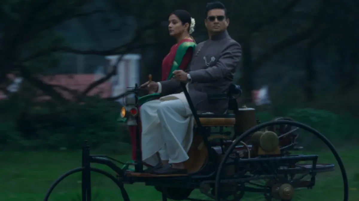 R. Madhavan as inventor GD Naidu, with Priyamani, riding an early motor carriage in a still from the GDN trailer