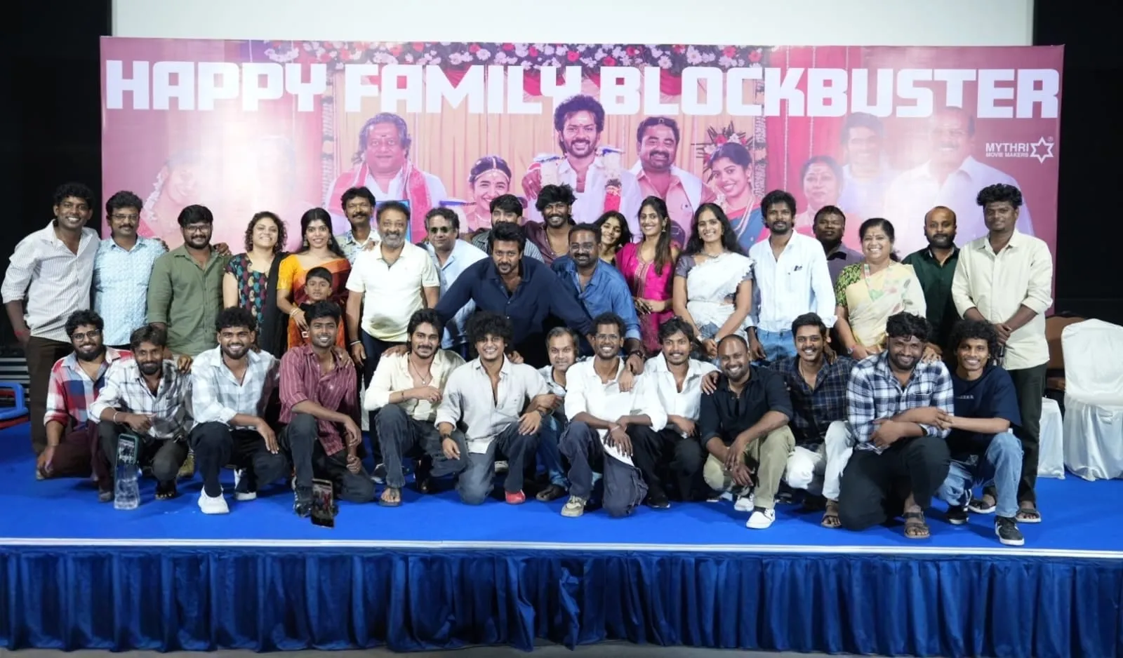 The Modha Rathri team gathers in two rows on stage for a group photograph at the film's success meet