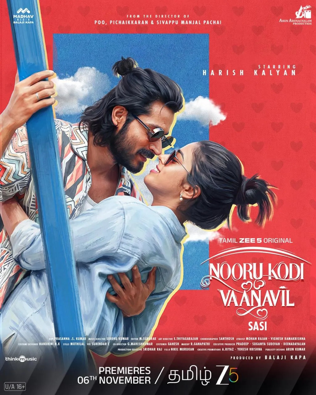 Nooru Kodi Vaanavil poster with Harish Kalyan and Siddhi Idnani in an embrace against a red backdrop