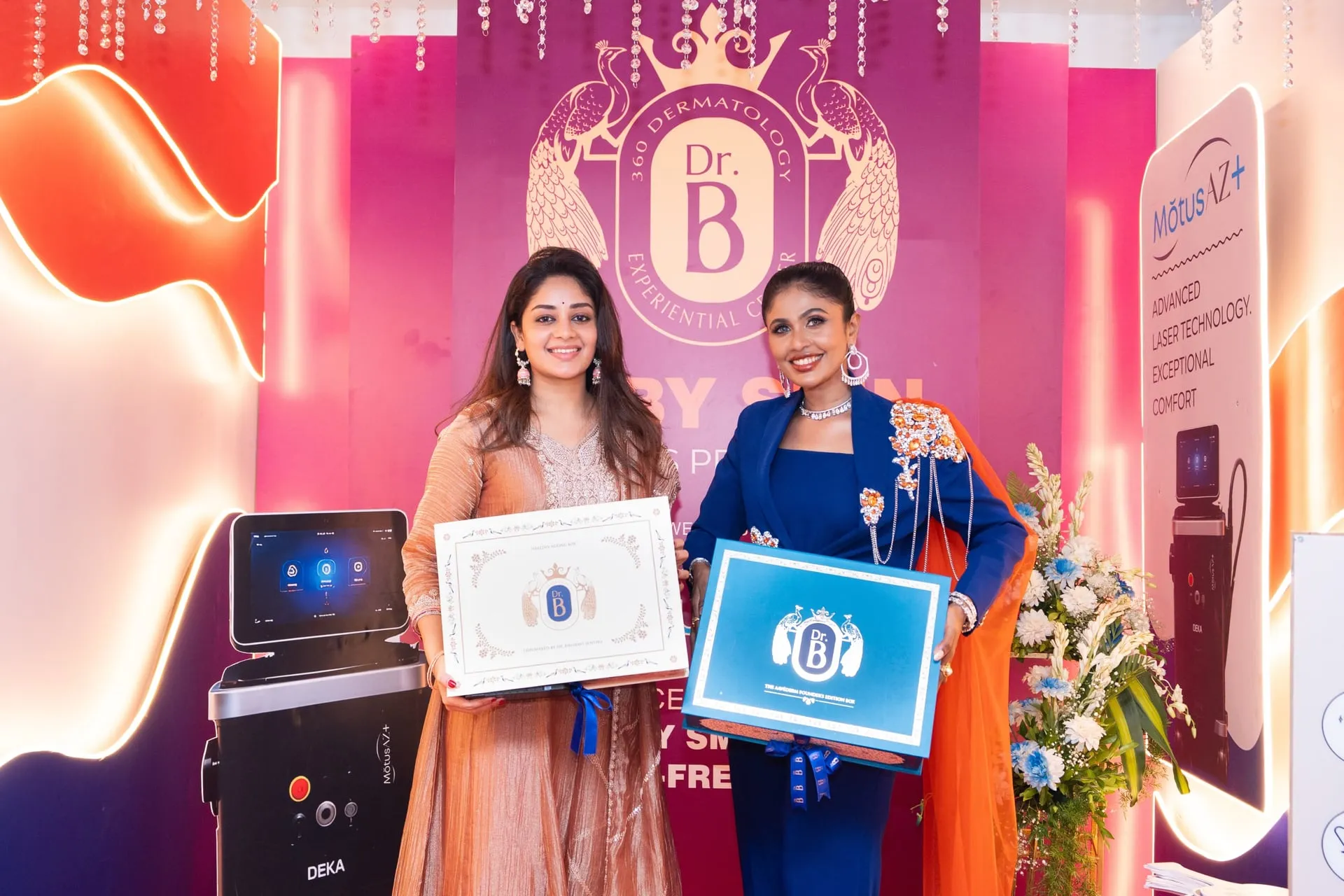 Archana Ravichandran and dermatologist Bhairavi Senthil hold up the programme certificate and box at the Dr. B 360 launch in Chennai