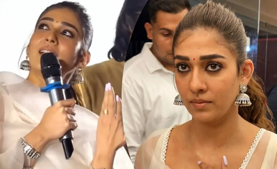 Nayanthara, in a white outfit, speaks into a microphone to the audience at Kamala Cinemas in Chennai during a screening of Hi, with a close-up of her face beside it
