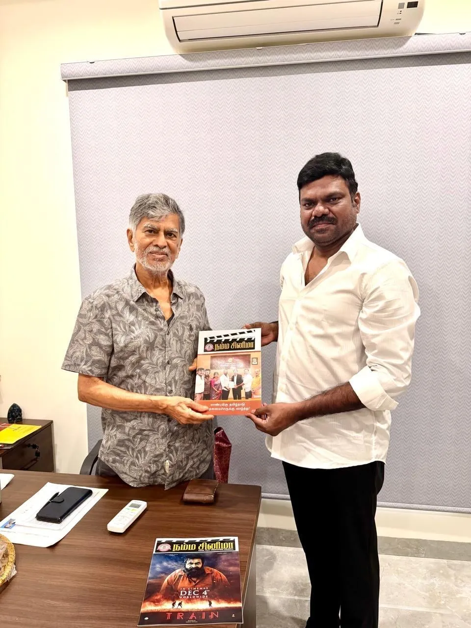 GKM Tamil Kumaran and S.A. Chandrasekhar hold a copy of the Tamil Film Producers Council's Namma Cinema magazine