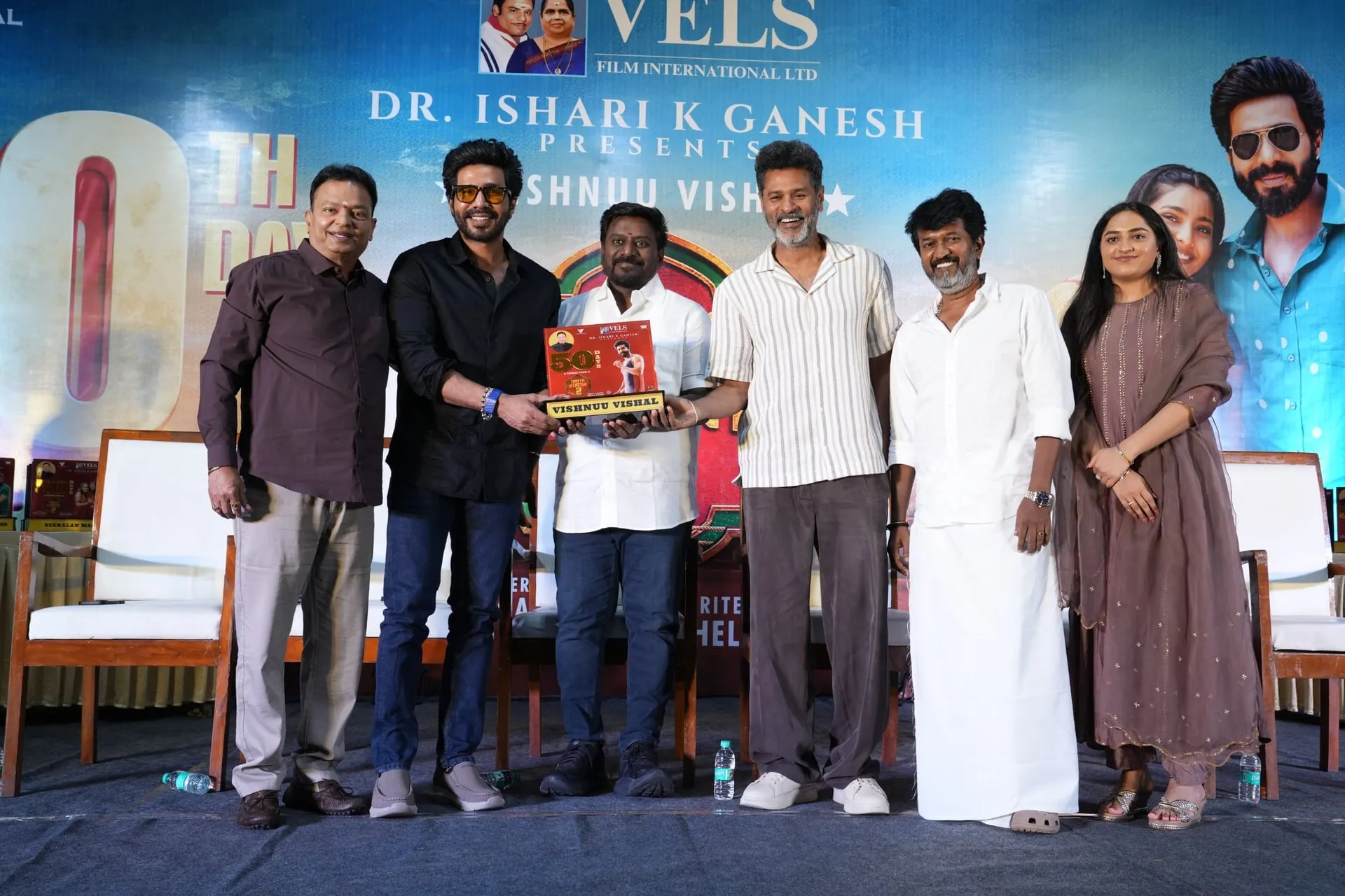 Vishnuu Vishal collects his 50th-day shield from Ishari K Ganesh, with Chella Ayyavu, Prabhu Deva and minister Rajmohan alongside