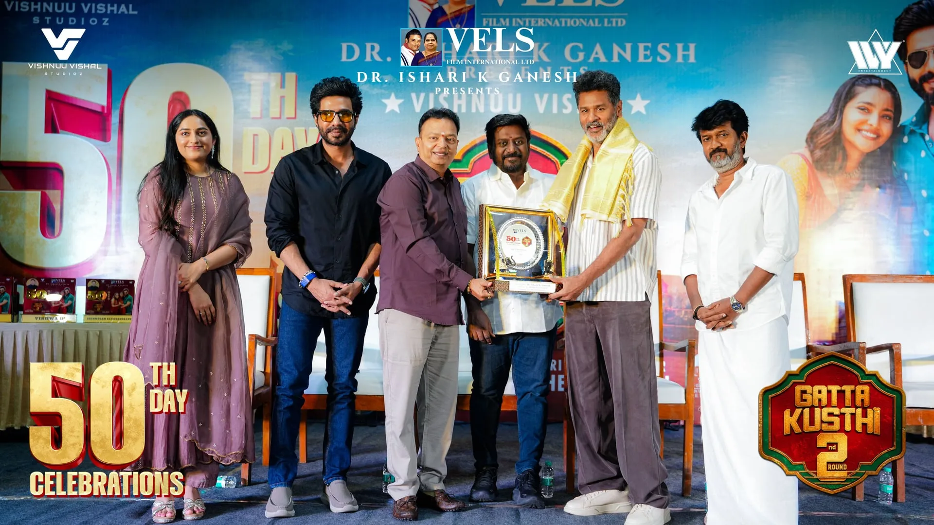 Prabhu Deva, in the shawl, is honoured by Ishari K Ganesh and minister Rajmohan, with Kushmitha Ganesh, Vishnuu Vishal and Chella Ayyavu watching