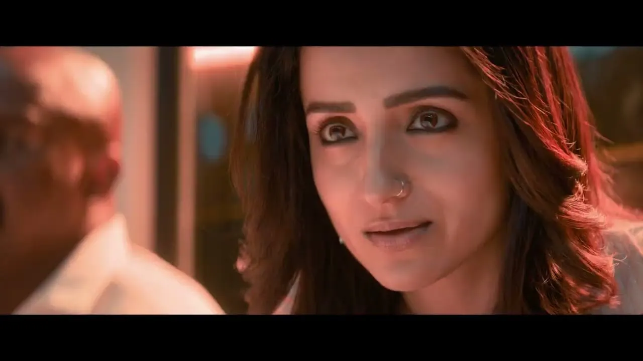 Trisha plays Preethi, a lawyer who has crossed paths with RJ Balaji's antagonist Baby Kannan before, in a frame from the Karuppu trailer.