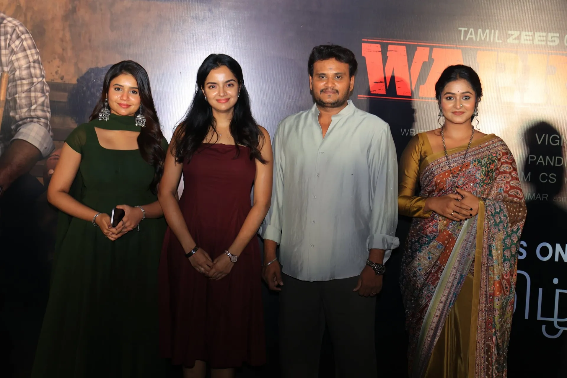 Three actresses from the Warrant cast with lead Prasanth Pandiyaraj at the trailer launch.