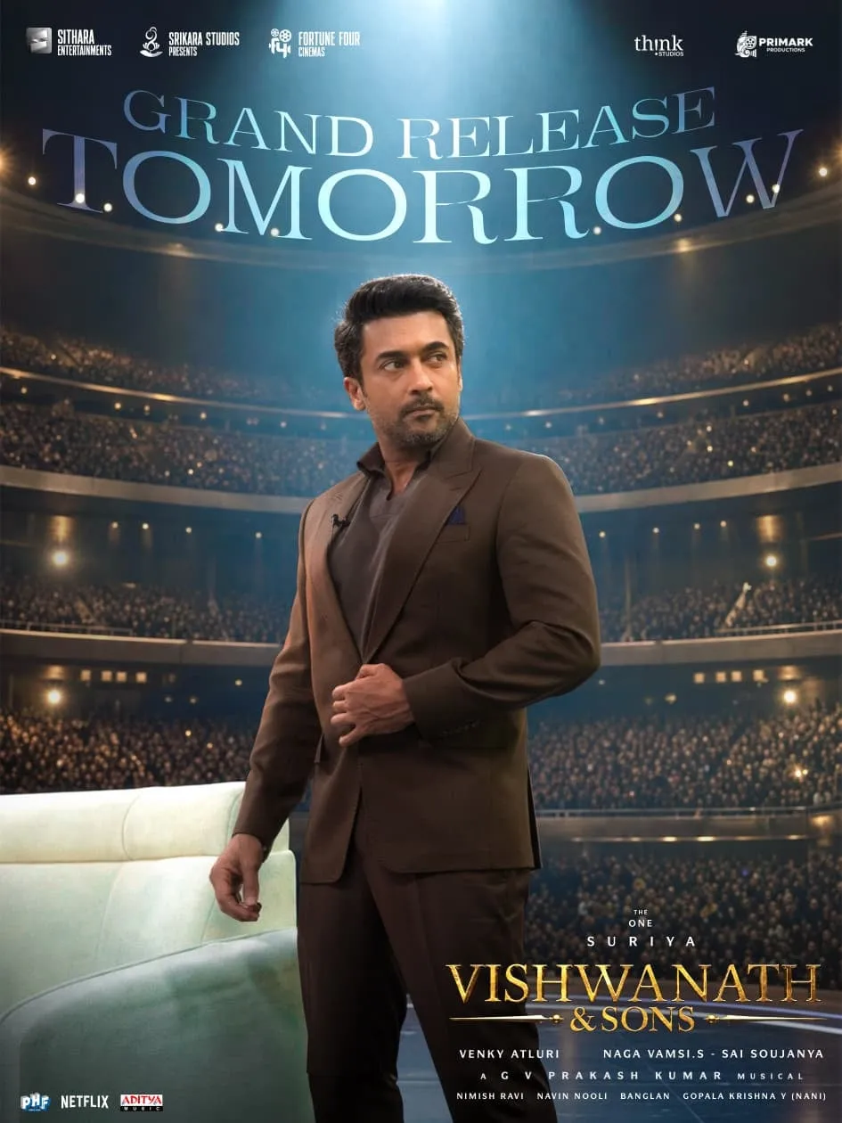 Vishwanath & Sons grand release poster with Suriya in a brown suit before a full auditorium