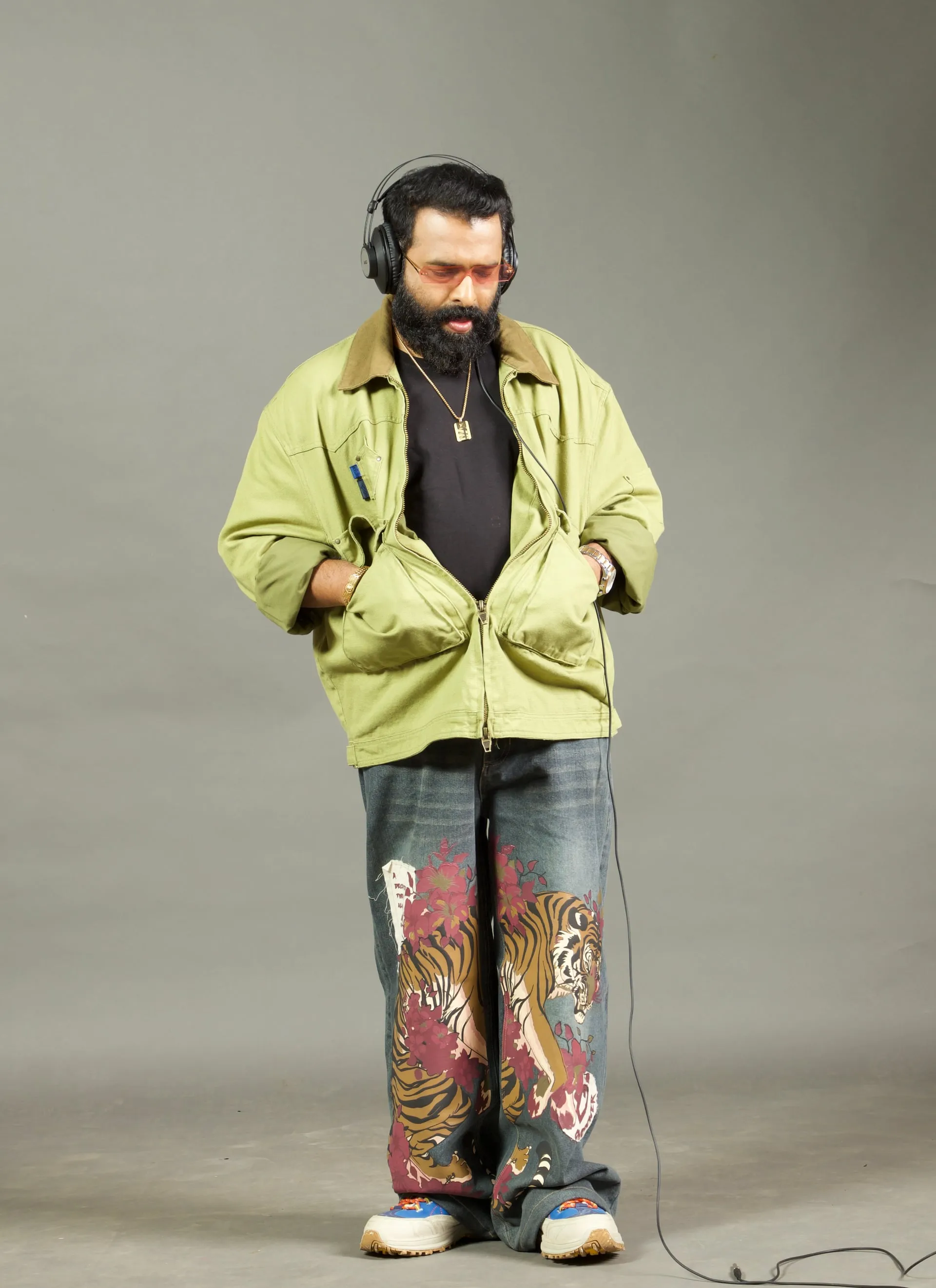 Santhosh Narayanan in headphones listening to a playback