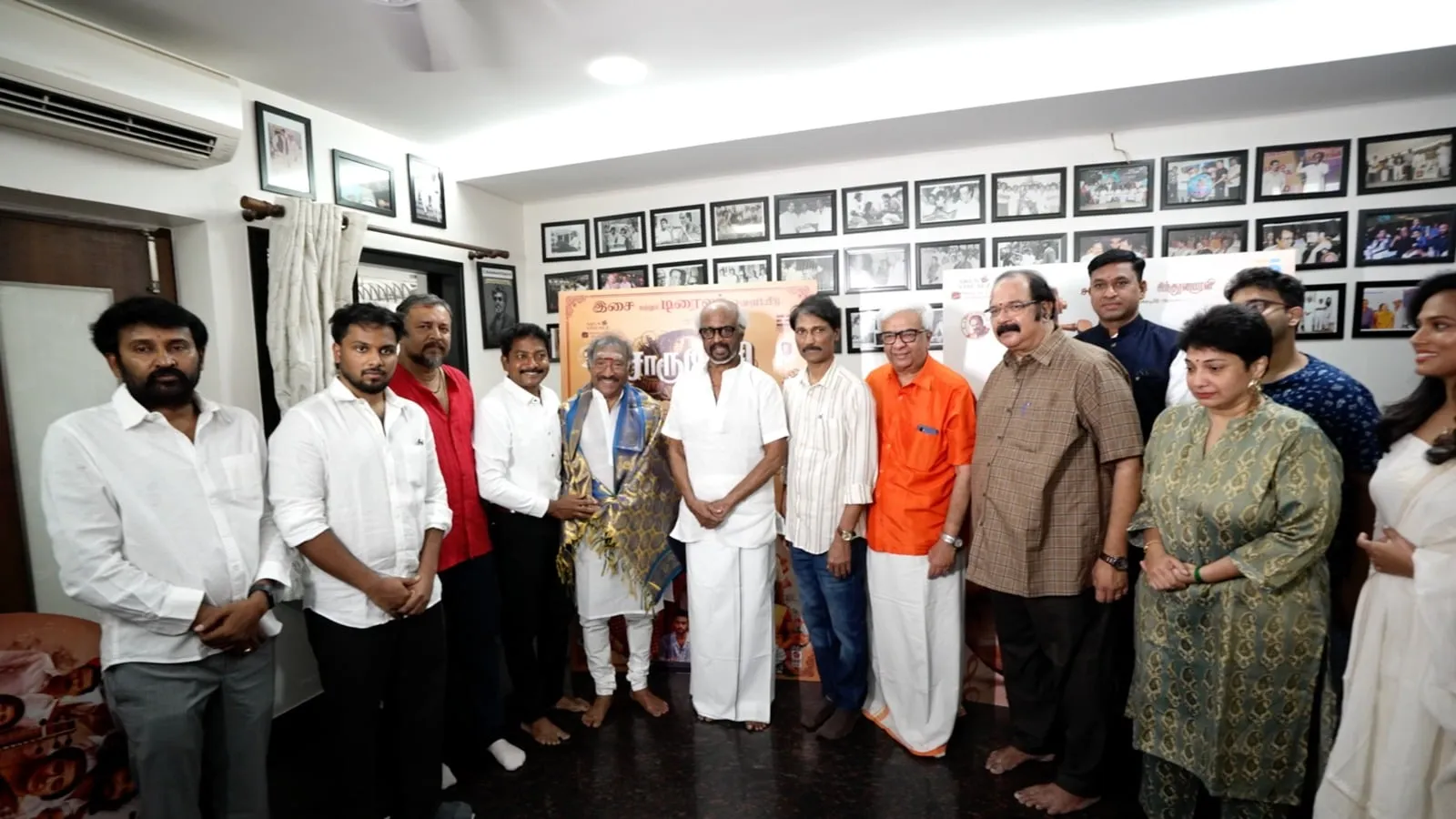 Rajinikanth flanked by Y Gee Mahendra in saffron and the wider Charukesi team at Thursday's trailer and audio launch.
