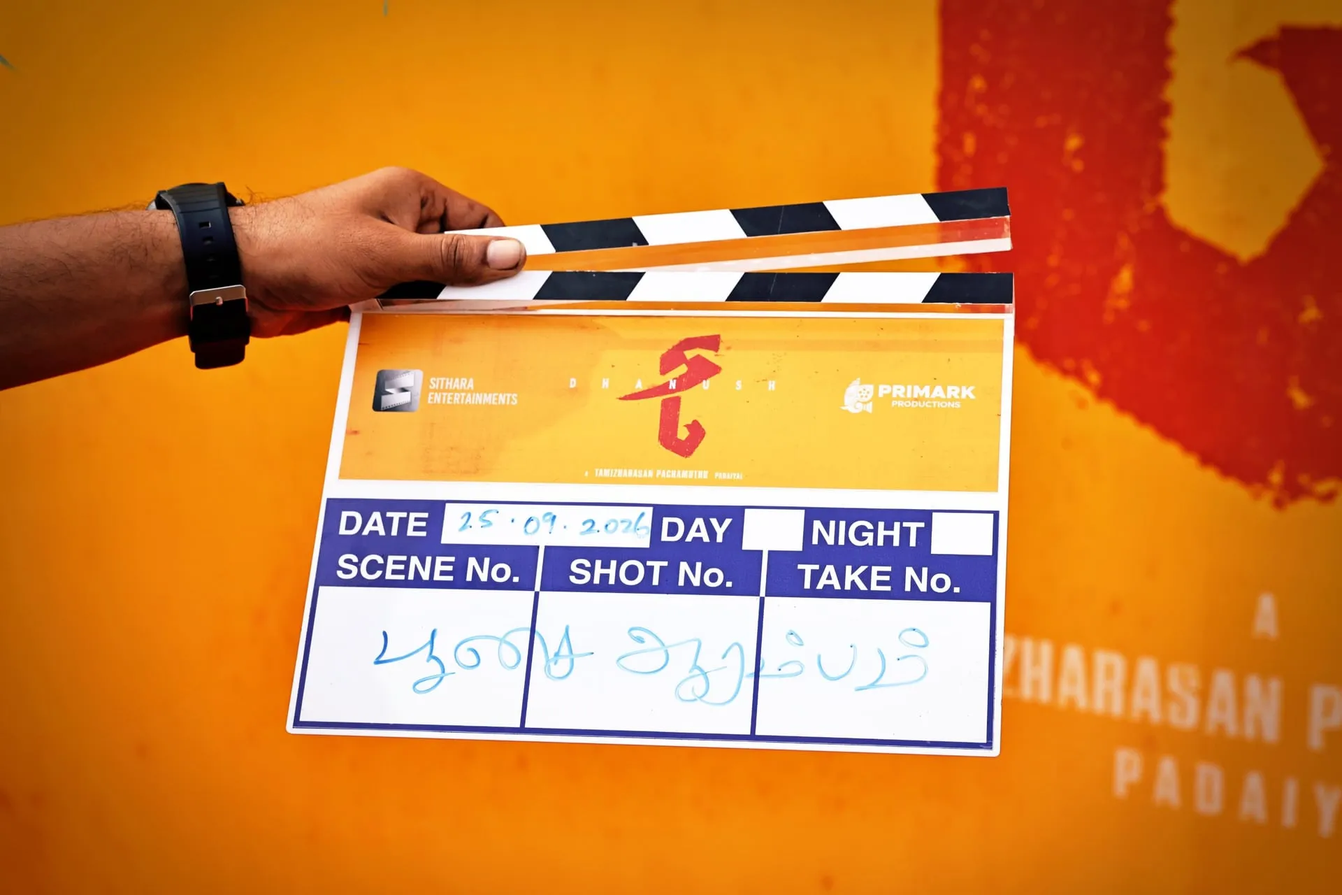 The D56 clapboard marked Pooja Aarambam, held up on the first day
