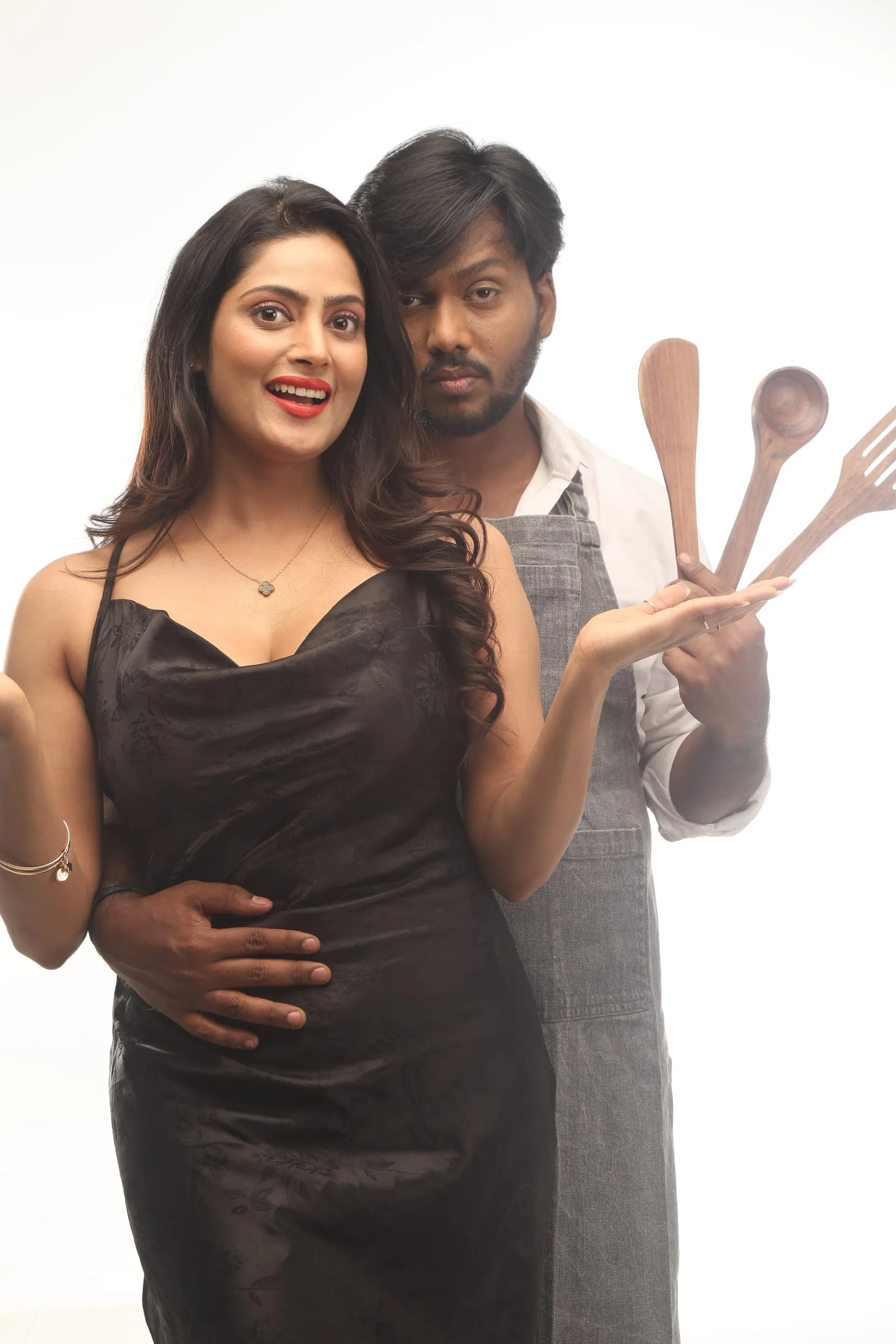 Sherry Agarwal and Nawaz in a stylised promotional still for Cycle Gap, against a clean white backdrop
