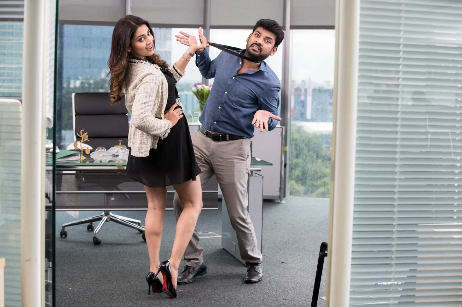 Shriya Saran has Vimal by the lanyard again, this time in a glass-walled corner office