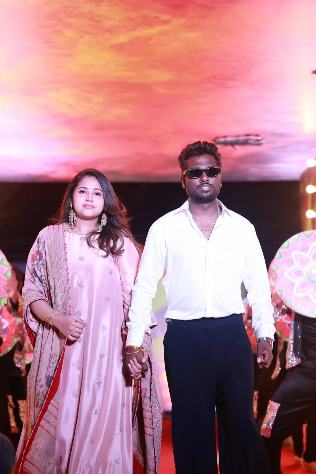 Two guests arrive together at the Baththa music launch