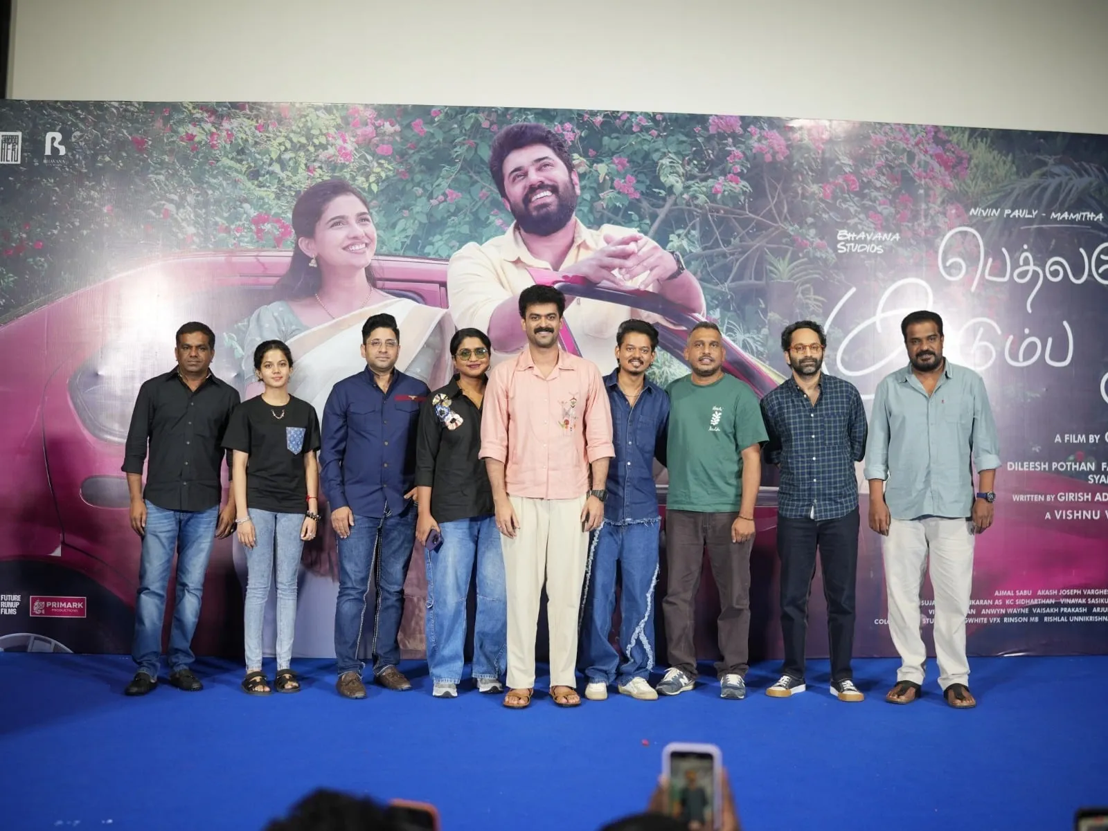 The Bethlehem Kudumba Unit team, including producer Fahadh Faasil, lined up on stage in front of the Tamil release poster at the press meet
