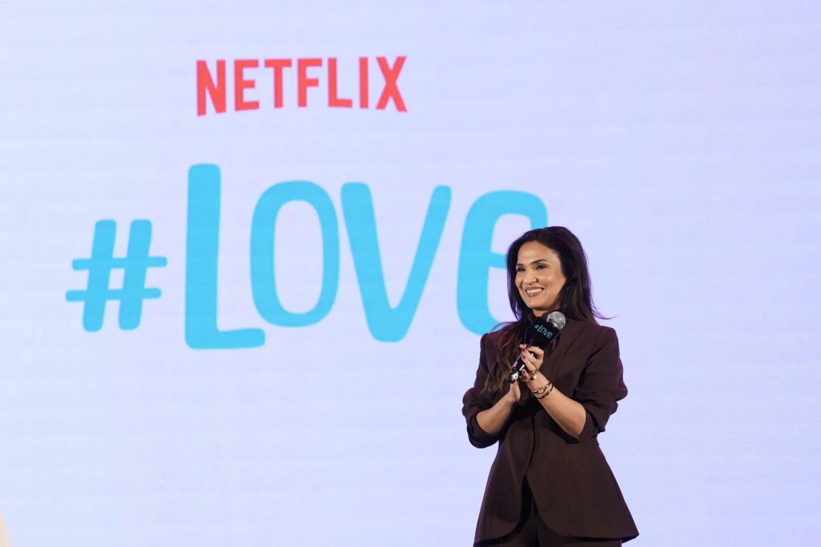 Soundarya Rajinikanth speaking onstage at the #Love trailer launch