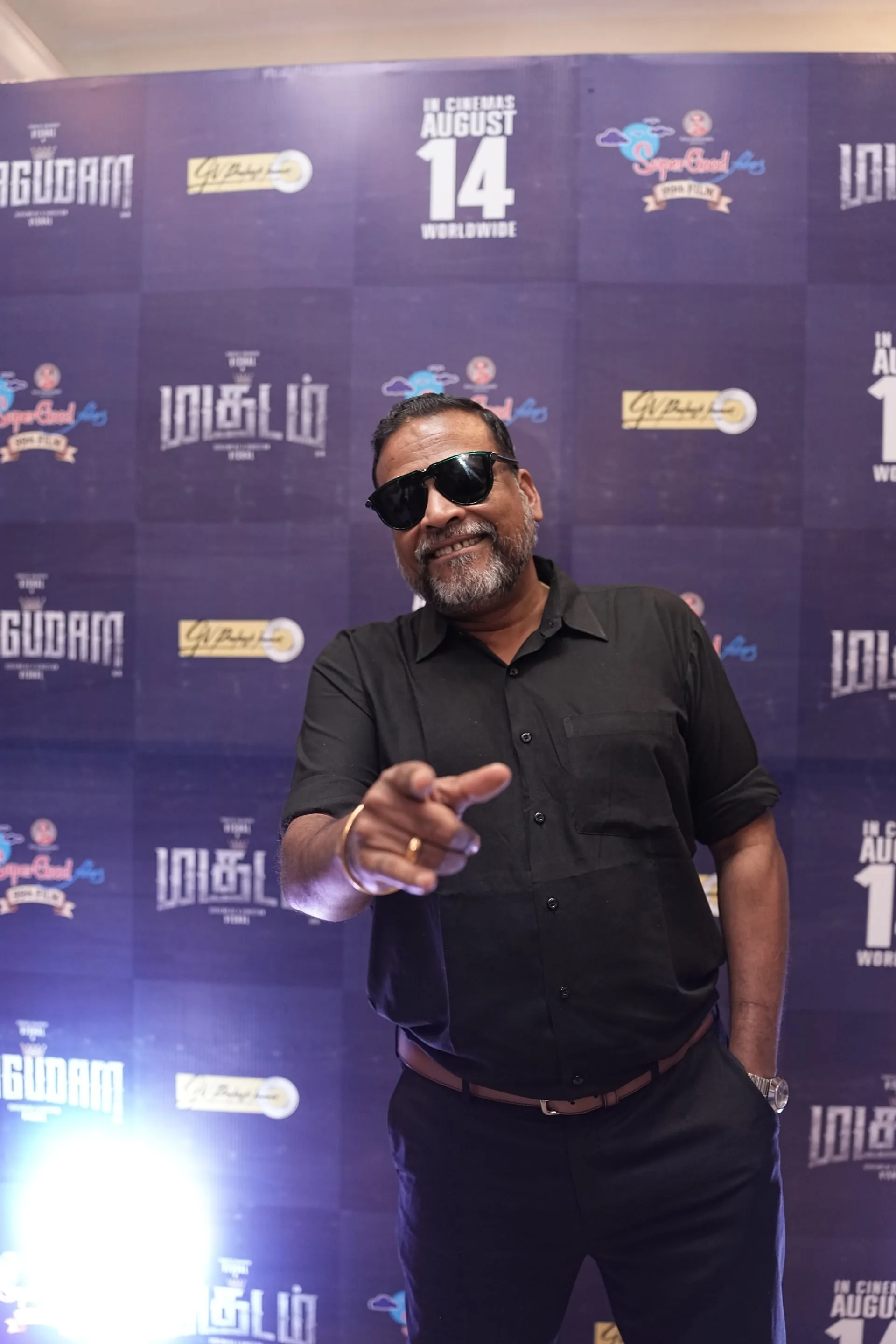 John Vijay in black shirt and sunglasses at the Magudam trailer launch