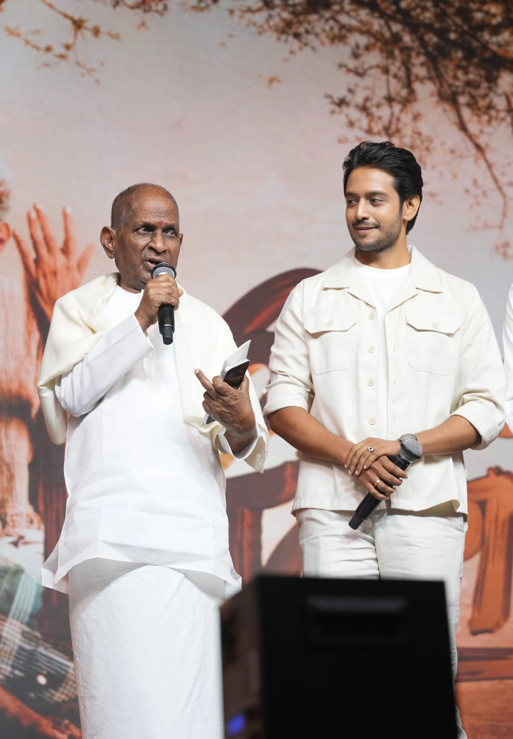 A speaker shares the stage during the Lenin Pandiyan event