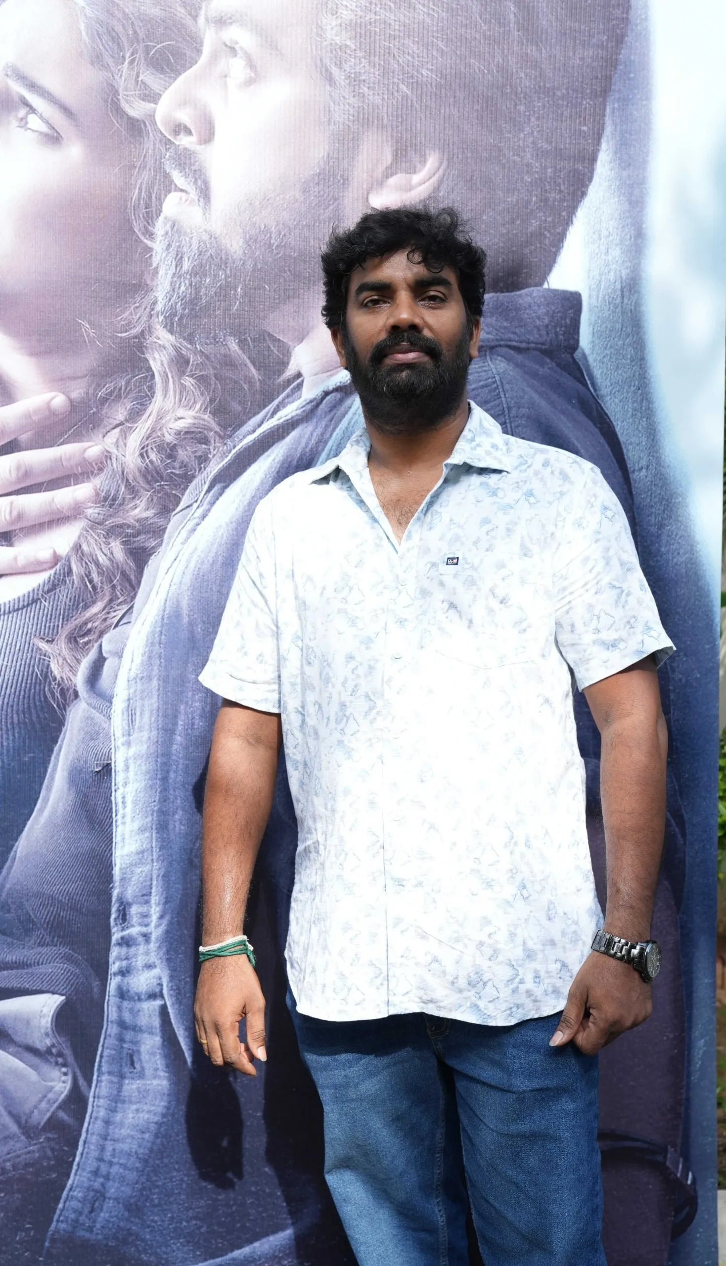 Portrait in a pale patterned shirt at the Immortal success celebration