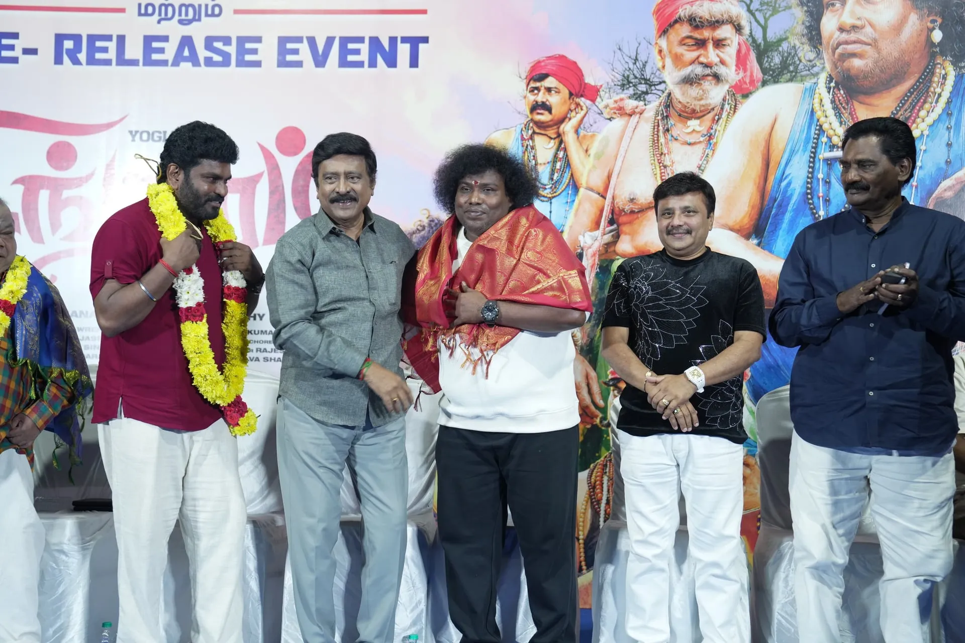 A felicitation on stage brings the Singgaramm team together during the celebrations.