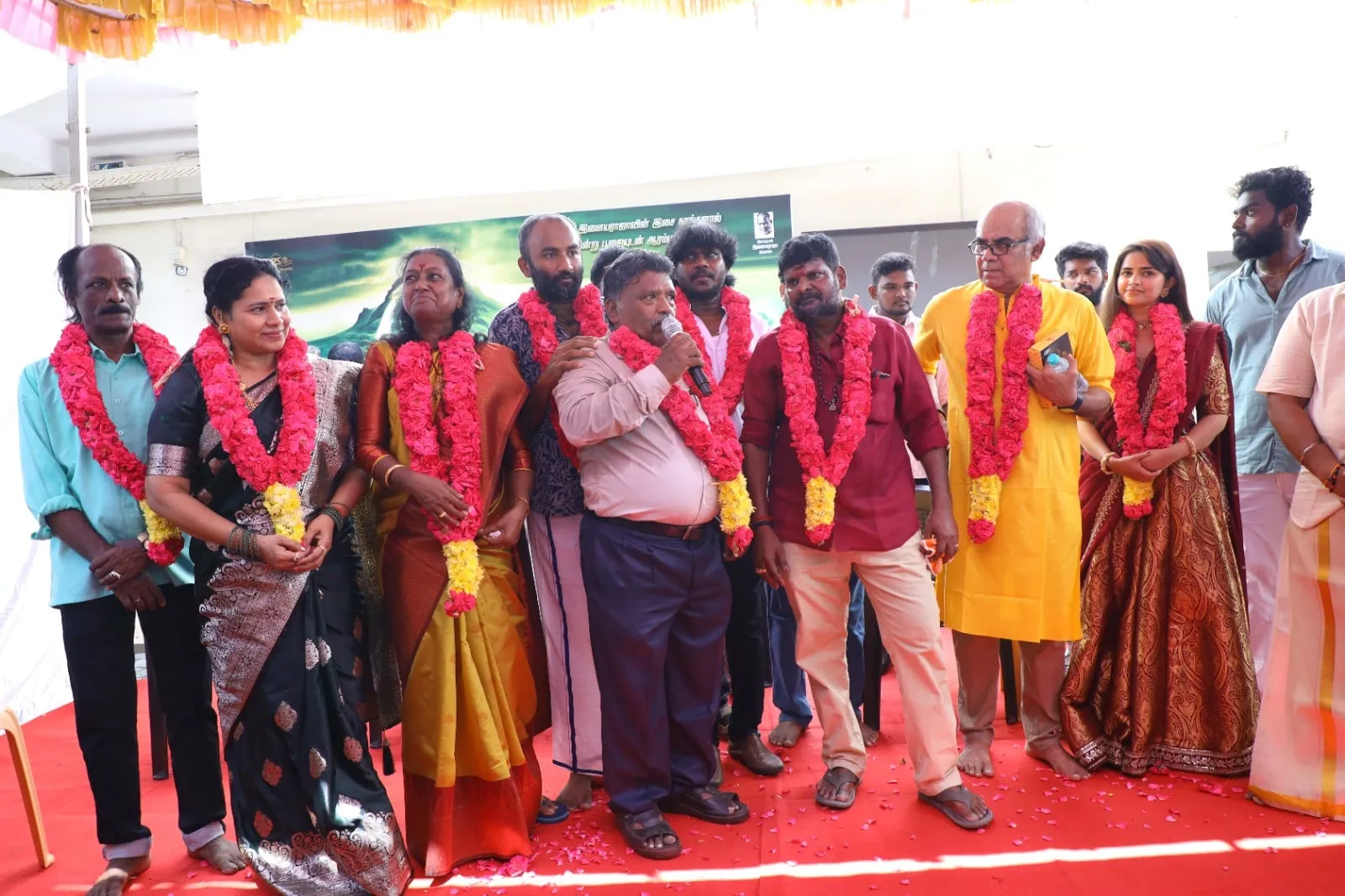 Garlands marked the occasion as the team came together for the film's launch.