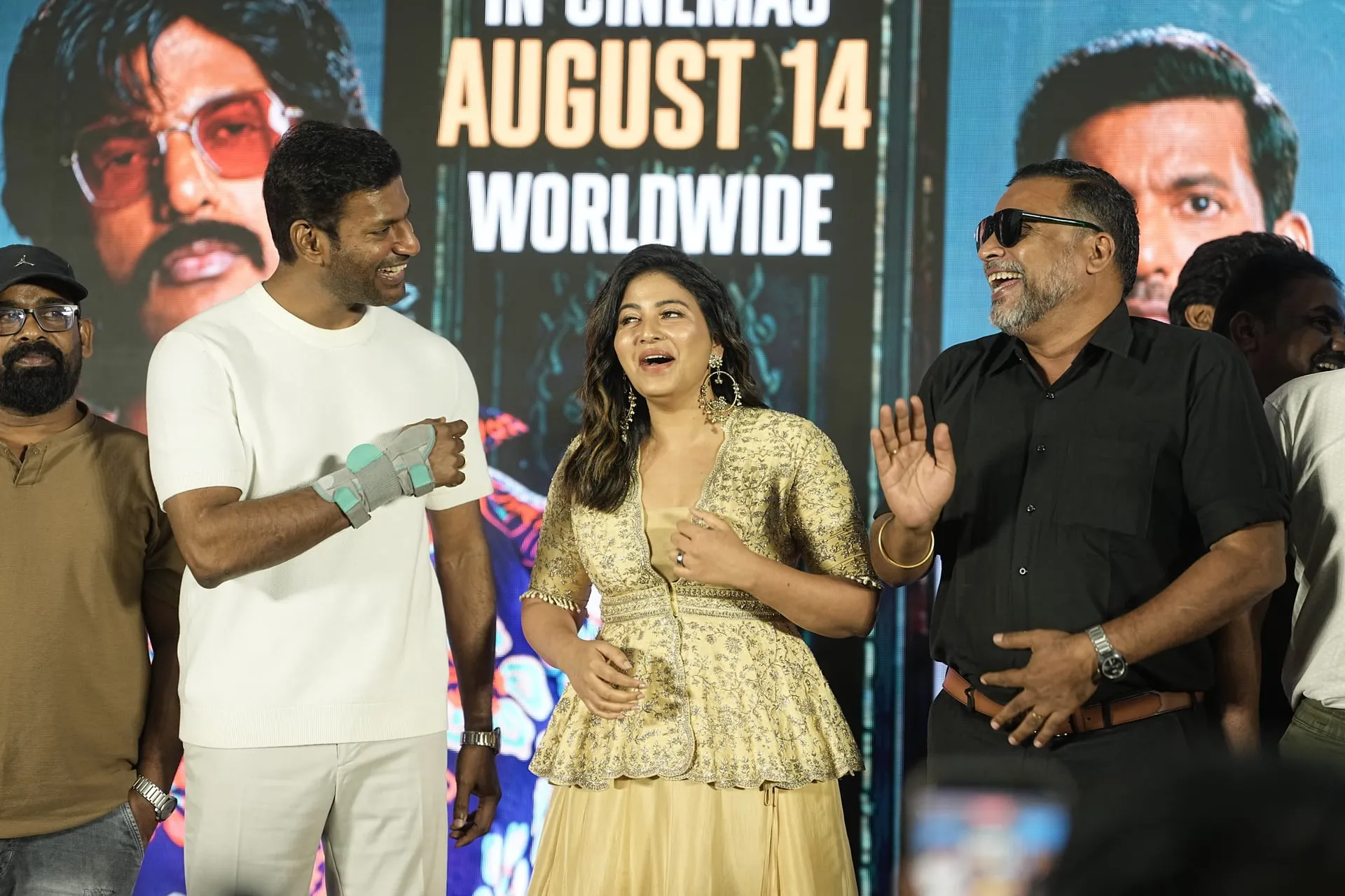 Vishal, Anjali and John Vijay share a laugh on stage at the Magudam trailer launch